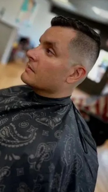 https://bombshellbarbers.com/wp-content/uploads/2025/05/skin-fade-man-1.webp